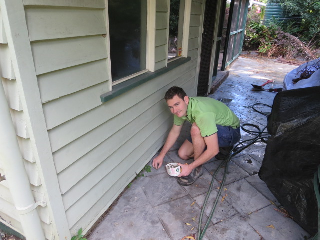 Alex filling in the drill holes with a special mortar mix