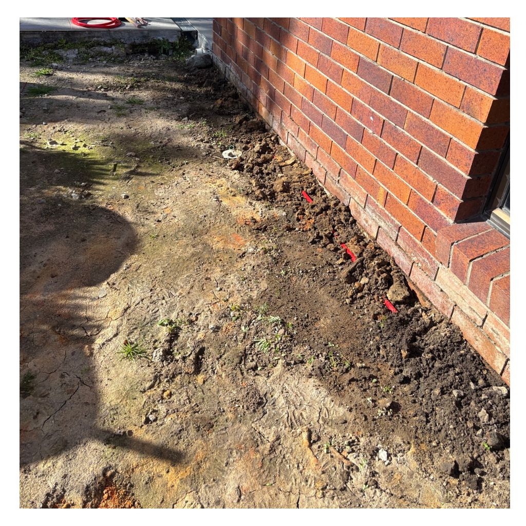 Reticulation pipe covered by soil and Termidor applied before concrete is laid on top